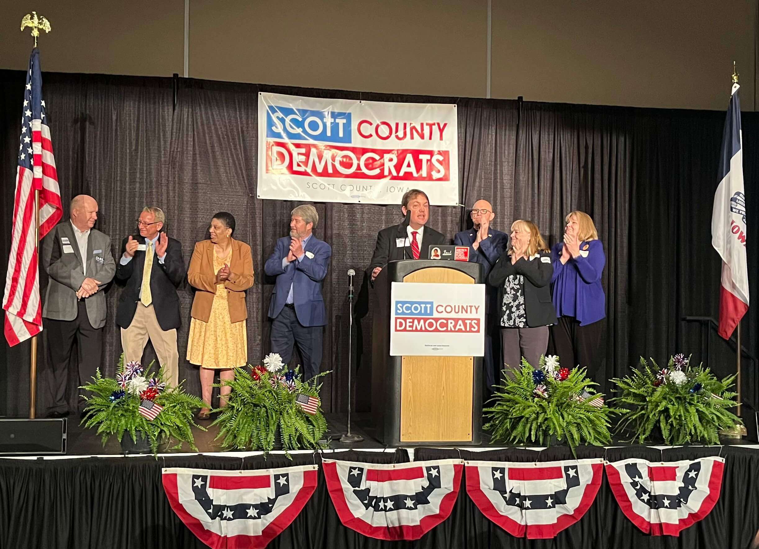 Scott County Democrats elected officials on stage