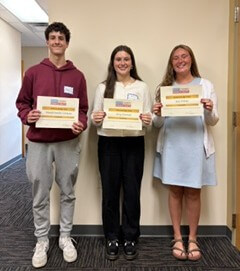 2026 scholarship recipients Maulid Sanchez Carmona, Avery Stineman and Jozie Perkins holding certificates